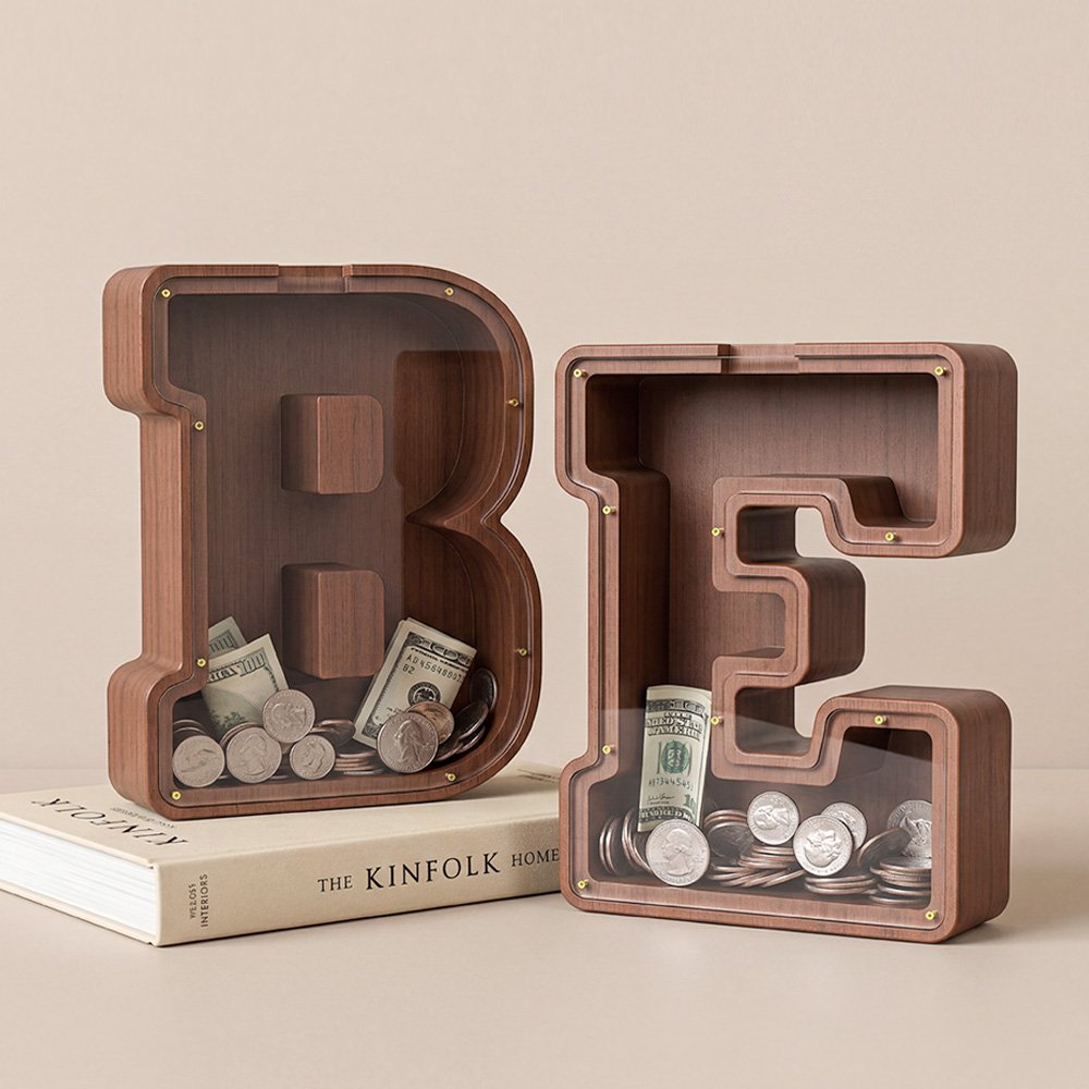 Pair of wooden letter piggy banks (B and E) placed together, initial combination savings jars for couple, family or personalized decor