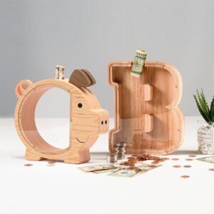 A natural wood pig-shaped money box displayed alongside a letter B alphabet bank. Surrounded by US dollar bills and coins, serving as rustic kids' room decor.