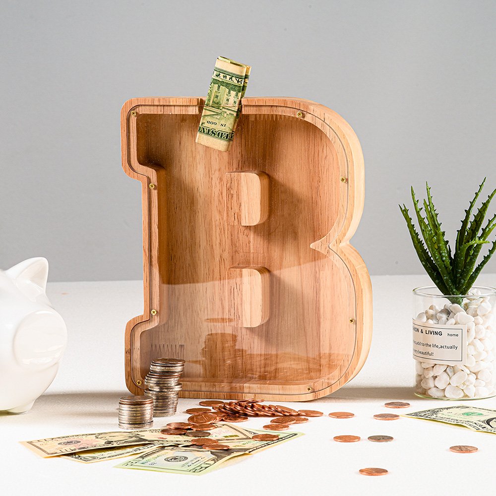 Summidate wooden letter B money box displaying paper bills and coins, an engaging way to teach kids financial habits. Popular fast shipping in the UK.