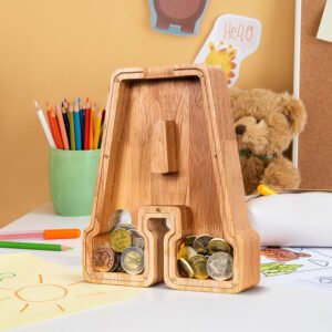 Eco-friendly Summidate wooden letter A piggy bank filled with coins on a child's desk, a great educational gift for learning to save in the USA.