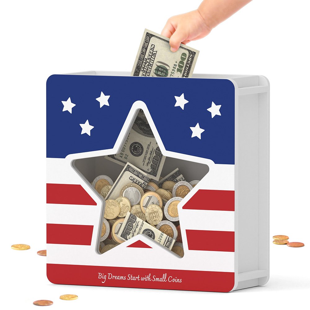A hand dropping folded paper money into the wide top slot of the American flag cash savings bank, showing it accepts both coins and bills.