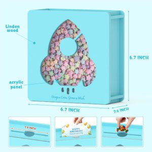 Product size dimensions and material details for the blue wooden spaceship money box, highlighting the shatterproof clear acrylic window shaped like a rocket.